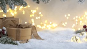 Christmas Holiday background with snow, fir tree gift box and decorations with christmas light behind. Christmas balls on a winter festive background. - Powered by Shutterstock - Get 15% off with code: PIKWIZARD15