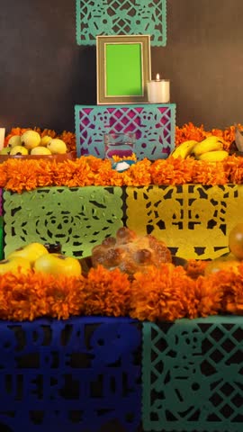 Vertical video, A Mexican woman setting up a Day of the Dead altar, a green screen frame on top. Mexican and Hispanic Traditions