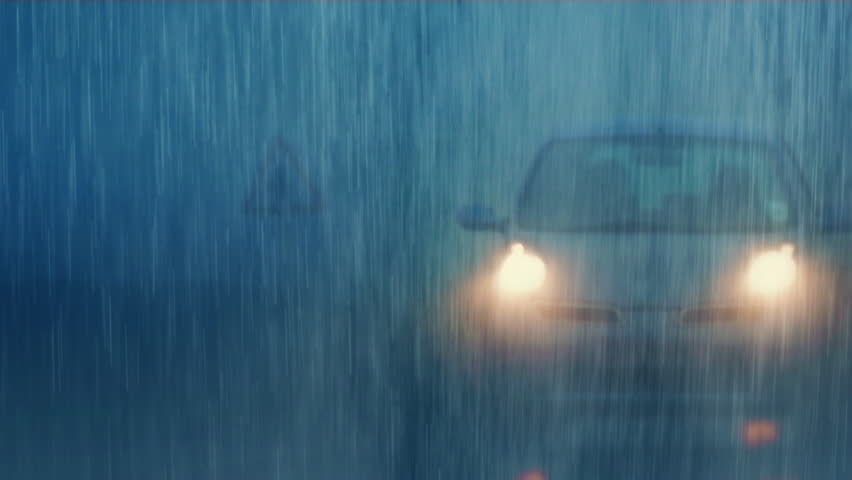 Cars Pass In Heavy Rain Atmospheric Scene