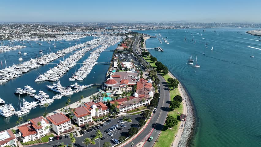 Shelter Island In San Diego California United States. Aerial View Of A Bustling City With High-Rise Buildings And Traffic. Shore Sky Clouds Beach Sea. Shore Seaside Panorama. San Diego California.