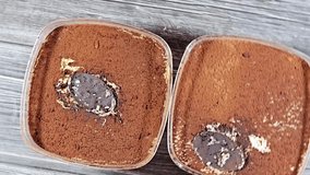 Tiramisu, an Italian dessert made of ladyfinger pastries (Savoiardi) dipped in coffee, layered with a whipped mixture of egg yolks, sugar, and mascarpone, and topped with cocoa powder - Powered by Shutterstock - Get 15% off with code: PIKWIZARD15