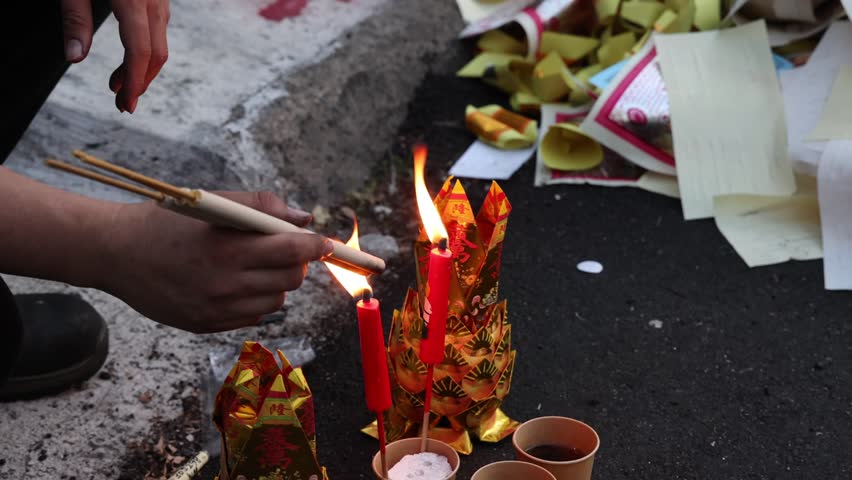 Chinese hungry ghost festival burning joss stick candle joss fake paper money flame fire smoke ash 