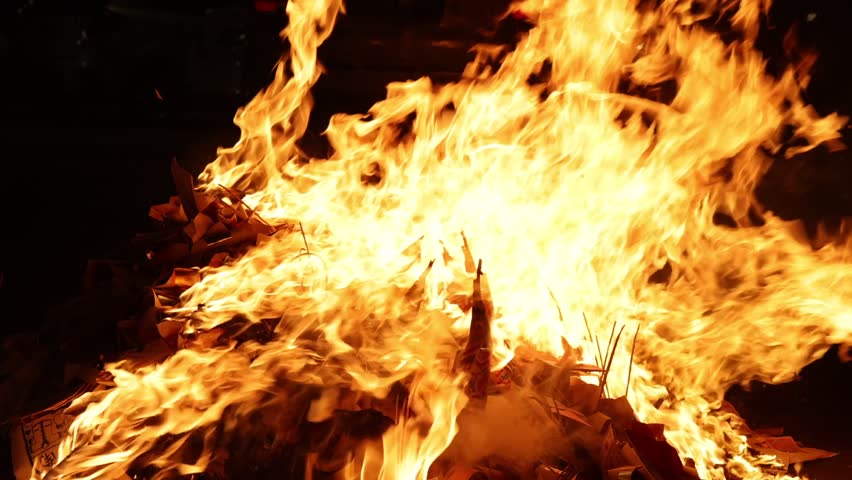 Chinese hungry ghost festival burning joss stick candle joss fake paper money flame fire smoke ash 