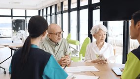 Elderly Asian people receiving explanation about nursing care facilities - Powered by Shutterstock - Get 15% off with code: PIKWIZARD15