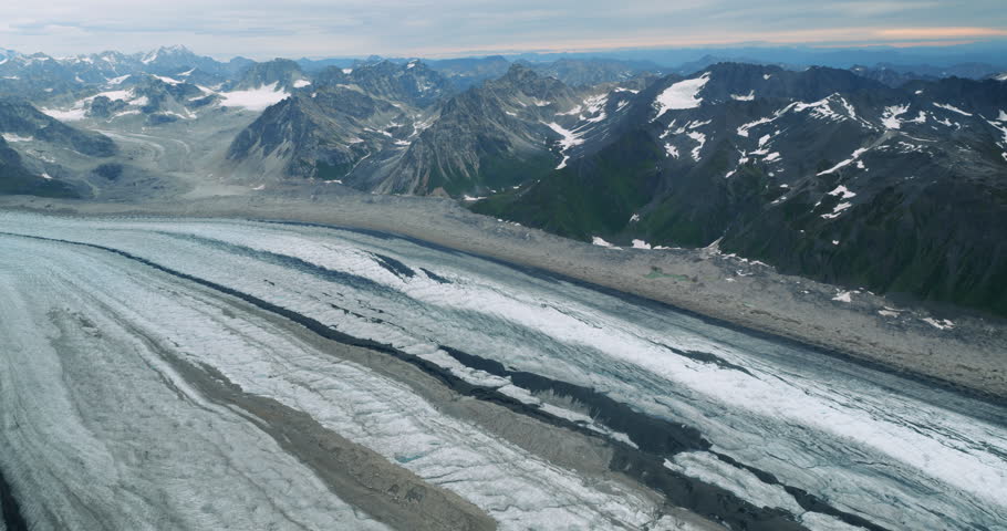 Flying above glacier formed by the melting waters of a glacier in Denali National Park, Alaska.