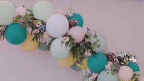 decorative wedding balloon arch in pastel colors with floral accents creating festive charm - Powered by Shutterstock - Get 15% off with code: PIKWIZARD15