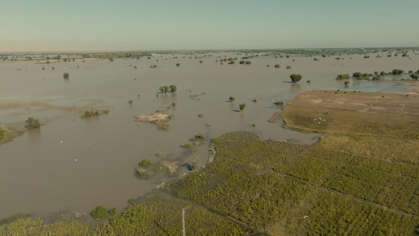 Aerial view of the devastating floods in Punjab, Pakistan, in 2025, showing submerged fields and infrastructure