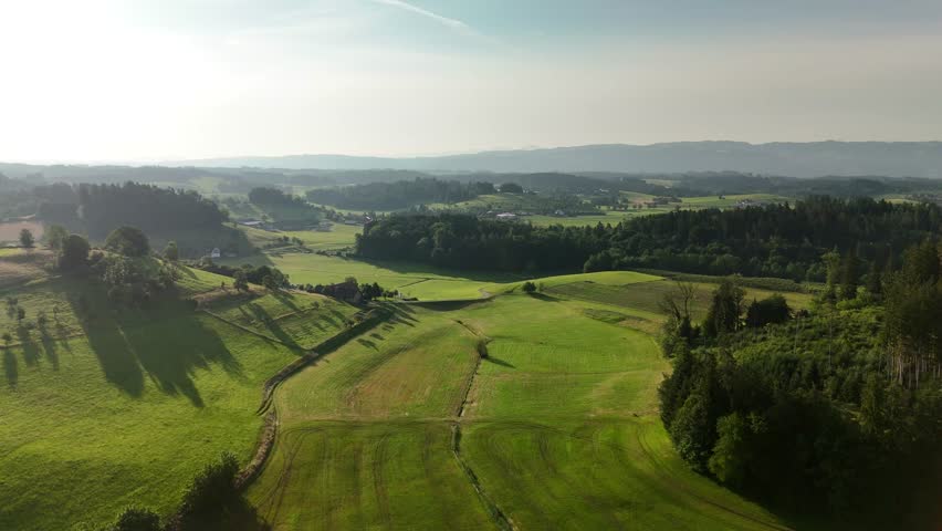 Charming Polish Village in Mountain Region with Country Road, Green Fields, and Blue Sky