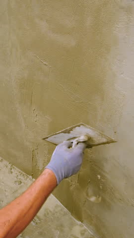 Apply waterproofing to the walls. Selective focus.