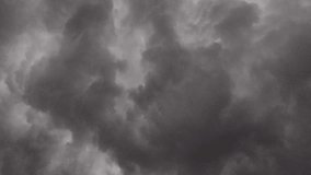 The dark thunder clouds, characterized by their towering, dark grey appearance, signal an impending storm with heavy rainfall and thunder, often forming giant cumulonimbus clouds during the rain. - Powered by Shutterstock - Get 15% off with code: PIKWIZARD15