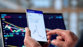 Senior Man Investing And Trading Stocks Using Mobile Phone App - Powered by Shutterstock - Get 15% off with code: PIKWIZARD15