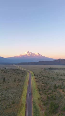 Aerial view of highway 97 leading to snow-capped Mount Shasta, California, United States.