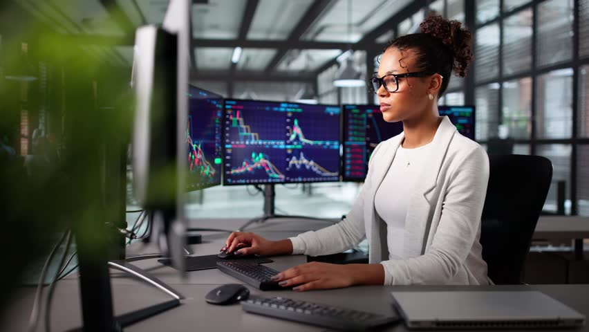 Women Using Computer Monitor For Stock Market Exchange Trade