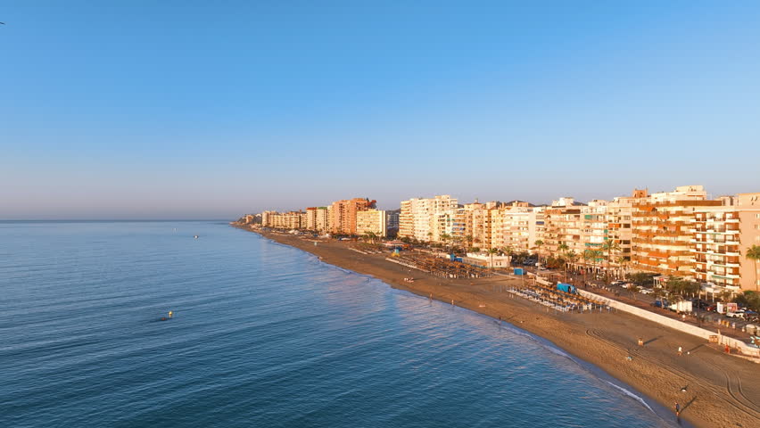 Flight up the Fuengirola seafront promenade, famous beach and tourist apartments