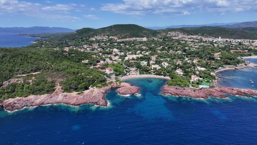 4k aerial video footage, flying along coastline of Agay Bay, French Riviera (Côte d'Azur) near Cap Dramont, a nature preserve, Cap Esterel and Beaches, "Plage de Camp Long" and "Plage d'Agay"