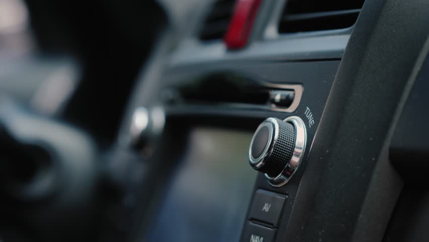 Male Hand Adjusts The Tuning Of The Car Radio Close-Up Shot 4k video
