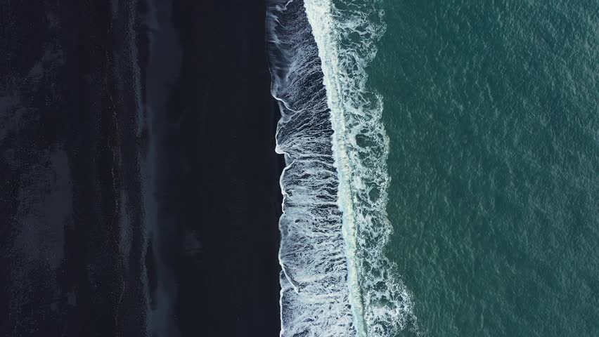 Waves Crashing on Black Sand Beach in Iceland