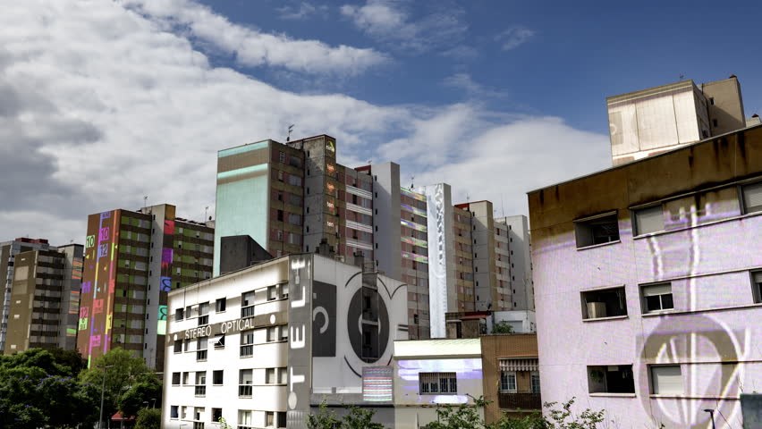 social housing apartment blocks in barcelona with cinema titles mapped onto the buildings 