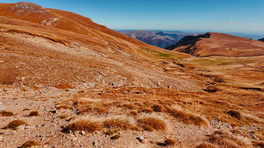 Sinaia Mountain, Transylvania, Romania, summit revealed with rocky outcrops, alpine grasses and wide horizons over rugged highlands
