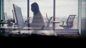 Corporate workers silhouettes typing computers in modern tech studio. Team of focused people debugging code. Open office with city panorama. Busy digital workflow and project development activities - Powered by Shutterstock - Get 15% off with code: PIKWIZARD15