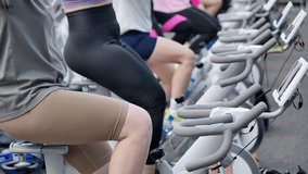 Group of People Exercising on Stationary Bikes - Powered by Shutterstock - Get 15% off with code: PIKWIZARD15