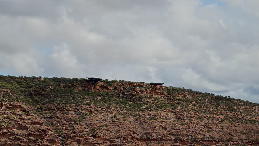 iconic skywalk bridge in beautiful landscape of Kalbarri national park in Western Australia along the coast of the indian ocean with beautiful red sandstone rock formation.