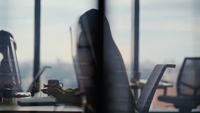 IT specialists silhouettes coding on computers in large coworking hub. Concentrated people writing scripts checking data on keyboards. Office room full of professionals completing project assignments - Powered by Shutterstock - Get 15% off with code: PIKWIZARD15