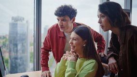 Office supervisors working computer in modern corporate workspace closeup. Three friendly company trainee videocalling online at panoramic coworking. Smiling colleagues planning project in open space  - Powered by Shutterstock - Get 15% off with code: PIKWIZARD15