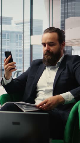 Vertical Video Outraged business director criticizing incompetent staff on a video call, displeased with the paperwork for the enterprise. Rude furious CEO screaming at people, bad leadership. Camera