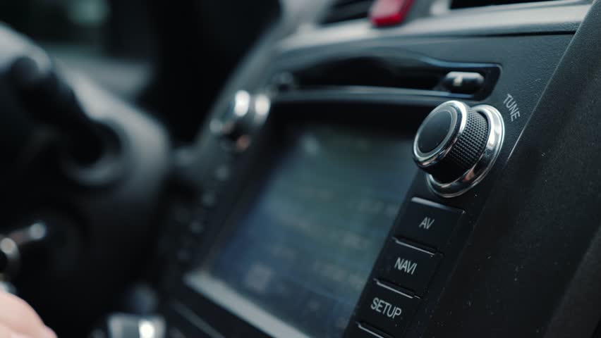 Male Hand Adjusts The Tuning Of The Car Radio Close-Up Shot 4k video