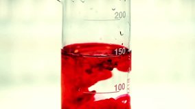 a red liquid in a beaker, showcasing a science experiment. Perfect for chemistry, lab, and research content. Explore the world of scientific analysis. 185 - Powered by Shutterstock - Get 15% off with code: PIKWIZARD15