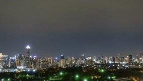 City skyline glows at night with illuminated buildings under a cloudy sky - Powered by Shutterstock - Get 15% off with code: PIKWIZARD15