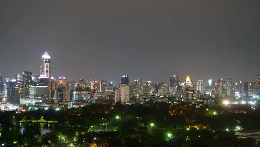 Bangkoks skyline glows at night from a distant vantage point