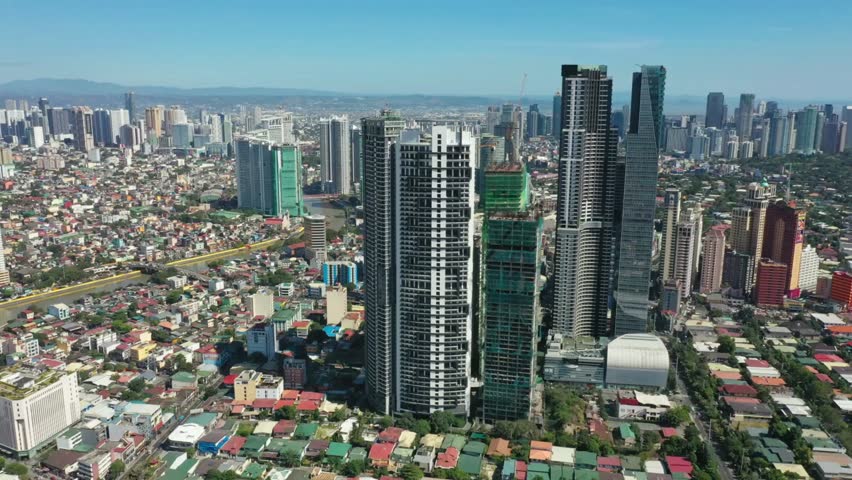 Aerial view of the modern cityscape of manila on a sunny day
