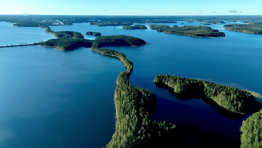 Experience the stunning views of Punkaharju esker, where lush forests meet tranquil waters. This natural landscape showcases Finlands unique geological features, inviting exploration and relaxation.
