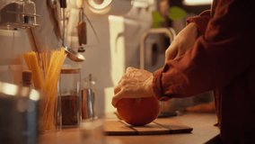 On a warm autumn evening, a man carves a pumpkin. This is part of the process of preparing a classic autumn dish a creamy pumpkin soup perfect for chilly evenings - Powered by Shutterstock - Get 15% off with code: PIKWIZARD15