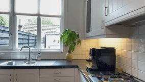 Medium shot of senior man making coffee at in contemporary residential kitchen with natural lighting from window. - Powered by Shutterstock - Get 15% off with code: PIKWIZARD15