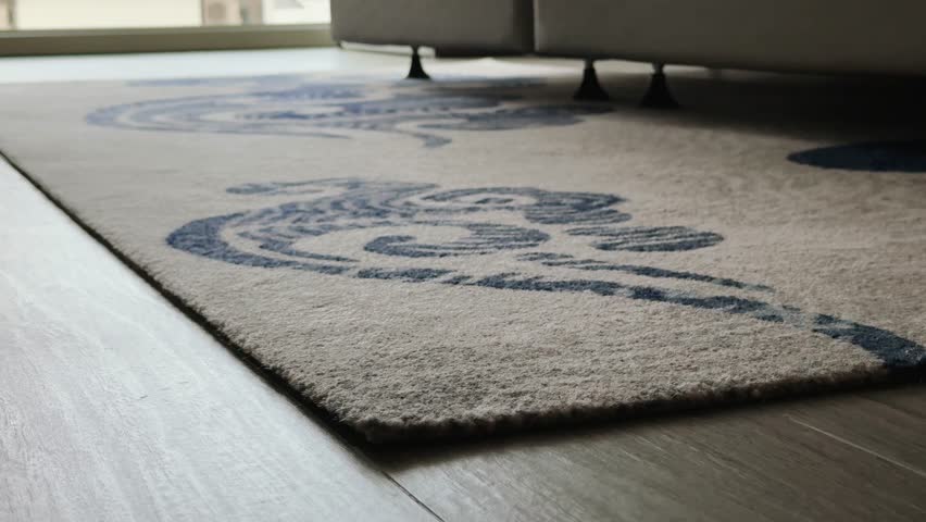 Close up of carpet edge on wooden floor in hotel room interior highlighting comfort luxury and modern design for guest experience