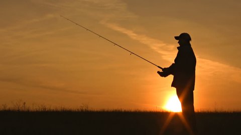 fisherman throws fishing tackles 
