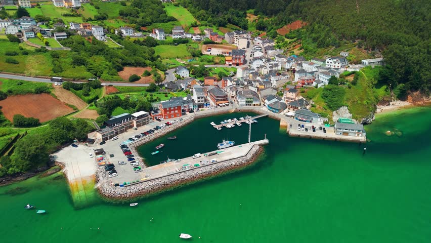 Aerial view of O Porto do Barqueiro, a picturesque fishing village and port in Manon, Ferrolterra, province of A Coruna, Galicia, Spain. Traditional coastal parish with maritime heritage.