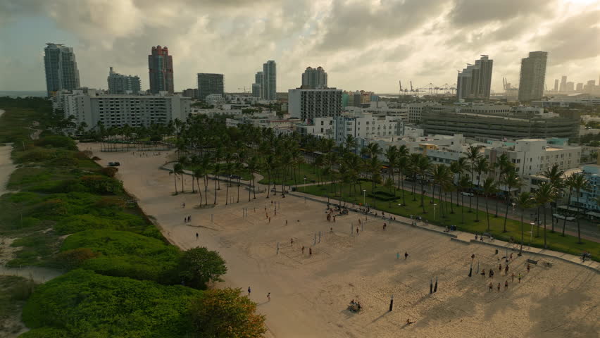 South Beach Miami with Volleyball Courts Palm Trees and Skyline Drone View