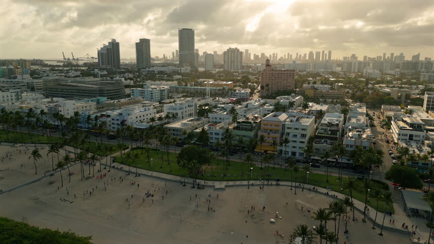 Miami Beachfront with Volleyball Courts and Skyline Drone View