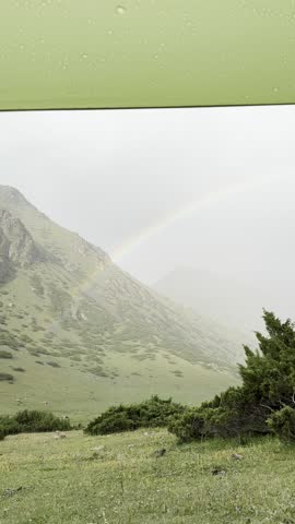 rainbow after the rain in the mountains