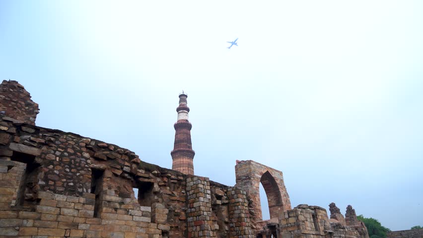 Jet Flying Above Historic Qutub Minar Tower