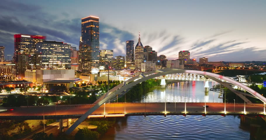 Highway traffic with driving cars on Korean Veterans Memorial Bridge in downtown district of Nashville city in Tennessee, USA.