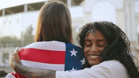 two female multiracial friends one inclusive woman in a wheelchair share a warm hug while enjoying a sunny day outdoors, one of them in a wheelchair, celebrating friendship and diversity - Powered by Shutterstock - Get 15% off with code: PIKWIZARD15