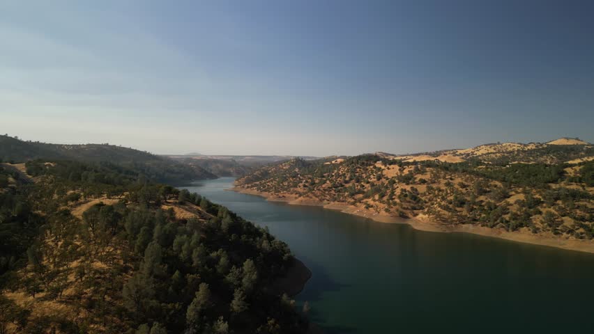 Aerial of Don Pedro Lake in California on smoky day at sunset