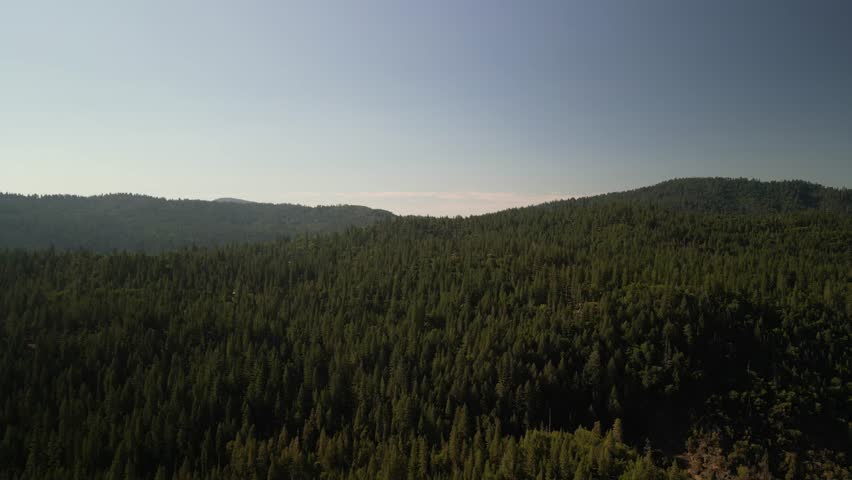 Aerial of Stanislaus National Forest near Sonora California on hazy day in summer