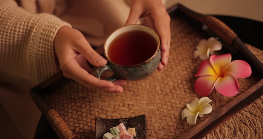 Relaxing thai massage experience with herbal tea ceremony and aromatic flowers.