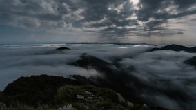 Moonlight Rays Shining Through Clouds Sky Over Misty Mountains at Full Moon Night Time Lapse - Powered by Shutterstock - Get 15% off with code: PIKWIZARD15